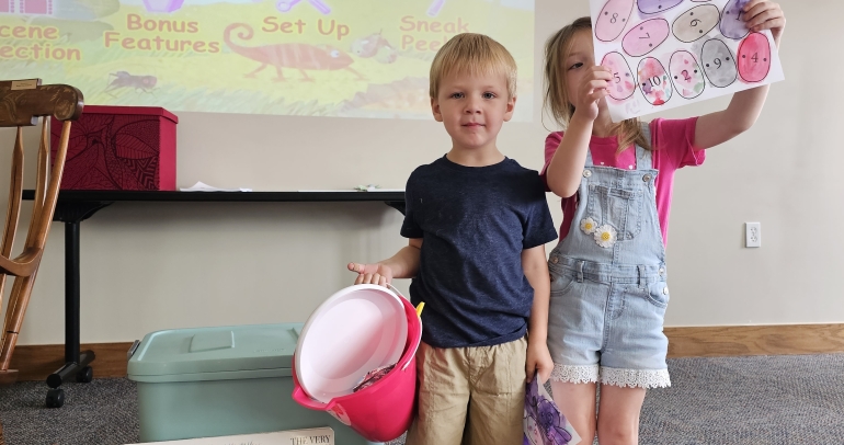 Storytime - Hungry Hungry Caterpiller - Small children holding crafts